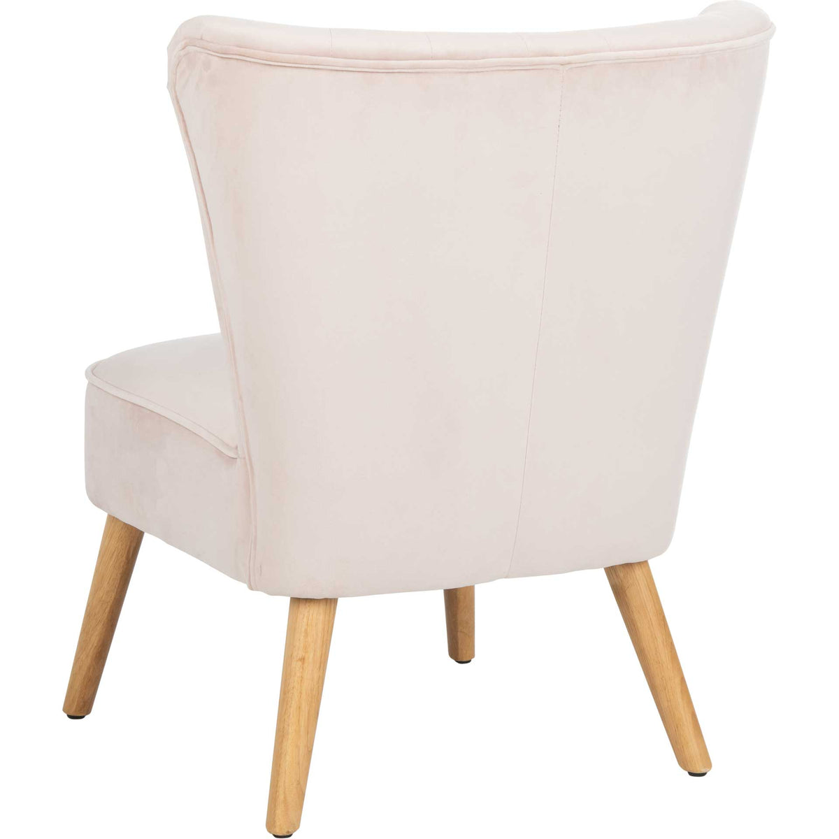 Blush velvet wraps the tall, flared back and rounded seat of this wood-legged accent chair