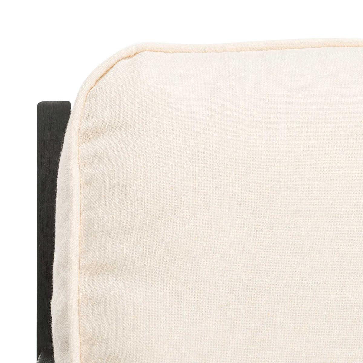 Piped seams add a tailored finish to the softly textured bone-white linen cushion