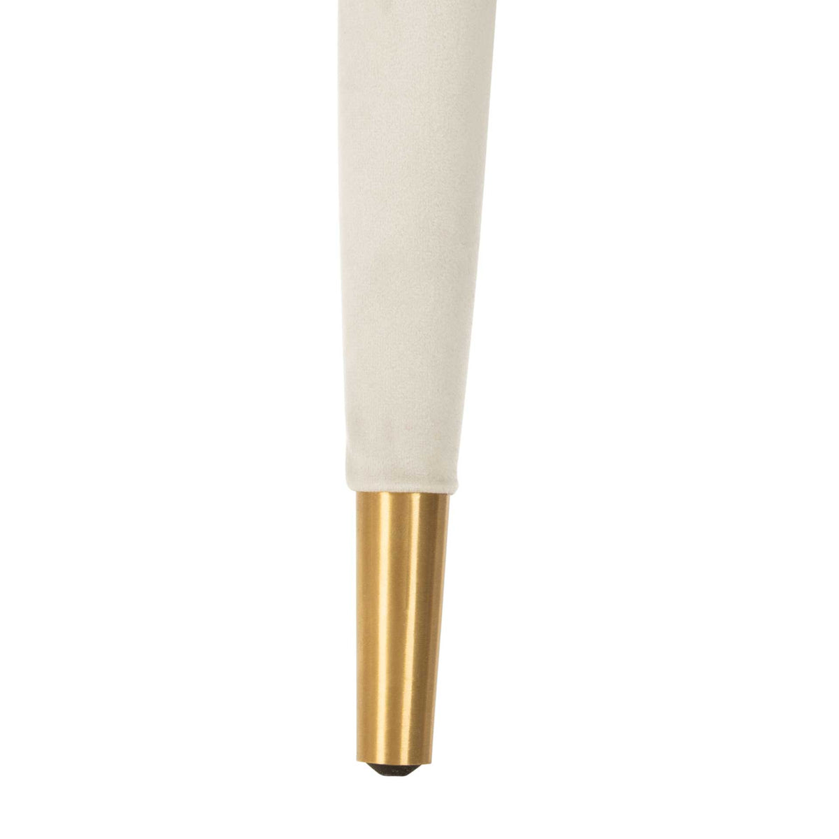 A tapered silver velvet-covered leg ends in a gleaming gold metal cap.