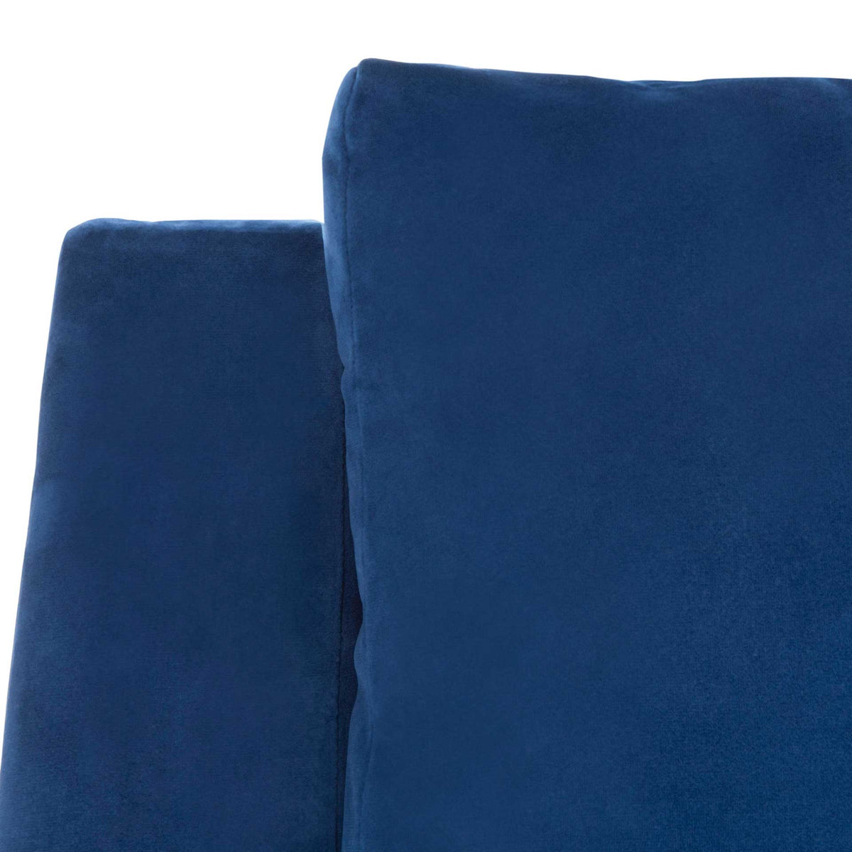Soft navy velvet highlights the tailoring along the arm and back cushion