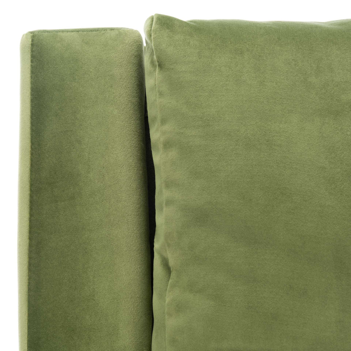 Soft olive velvet and neat seams define the arm and plump back cushion