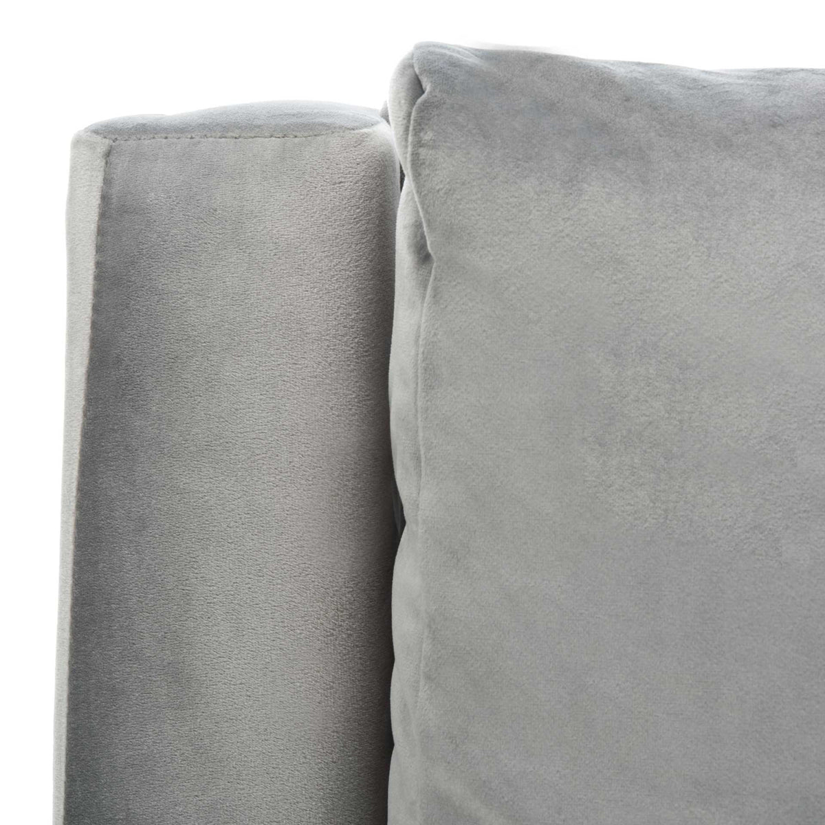 Stone gray velvet shows its soft texture along the padded arm and back cushion