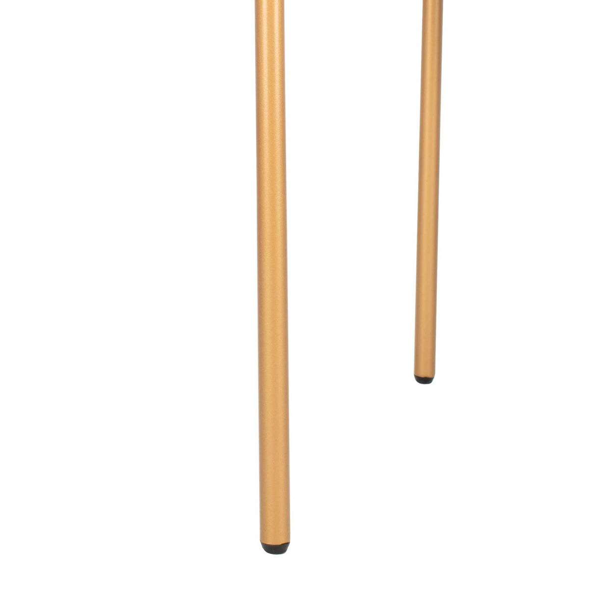 Narrow gold metal legs with dark tips give the chair a light, elevated stance