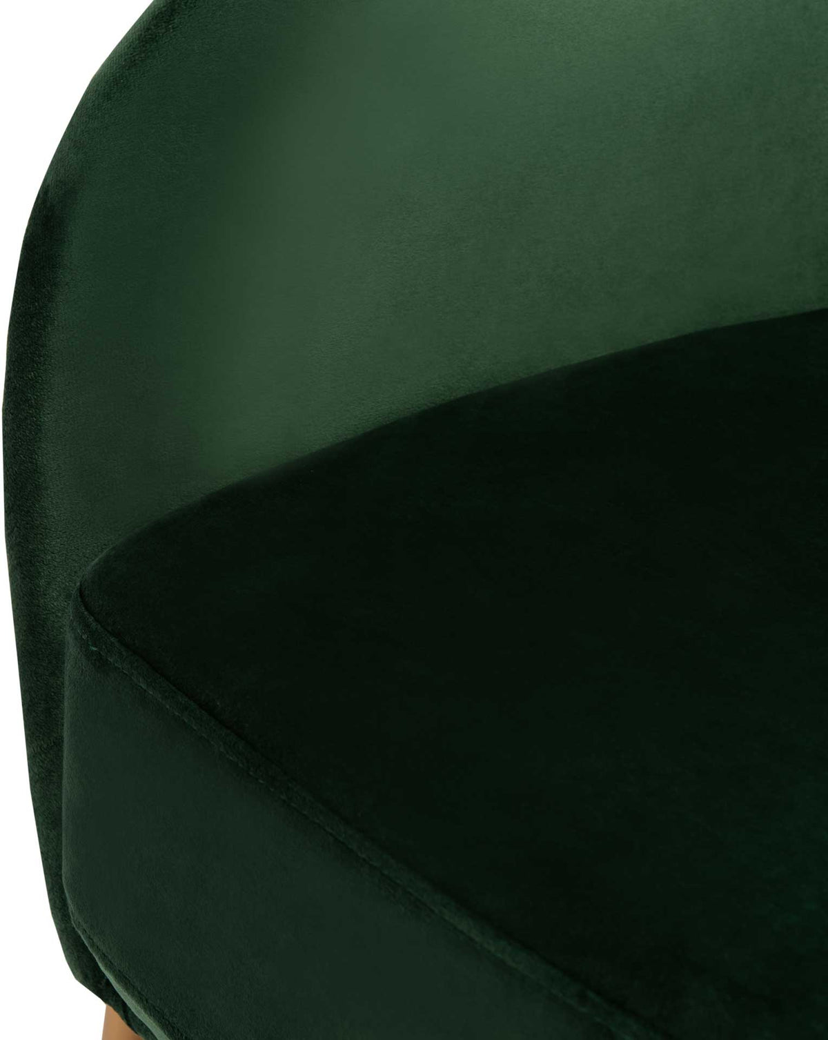 Rich green velvet softens the deep cushion and its enveloping upholstered shell.