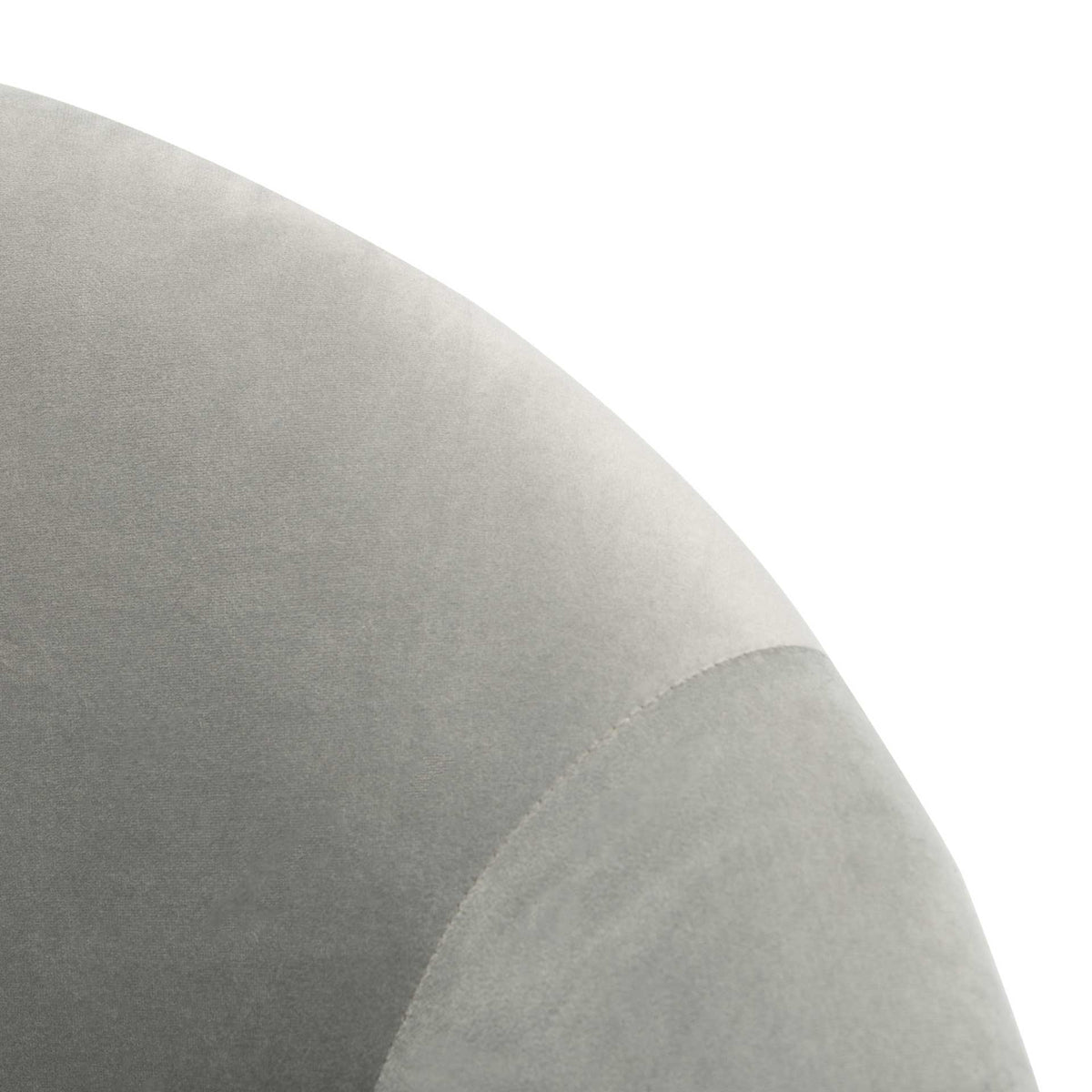 Gray velvet upholstery reveals the gentle curve and neat seam of the backrest