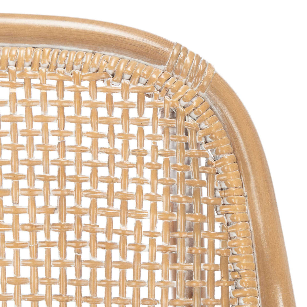 The curved rattan back displays intricate lattice weaving, wrapped joints, and a pale whitewashed finish.
