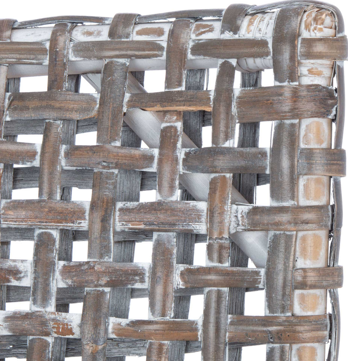 Gray-washed rattan strips cross in a loose, textured basket weave.