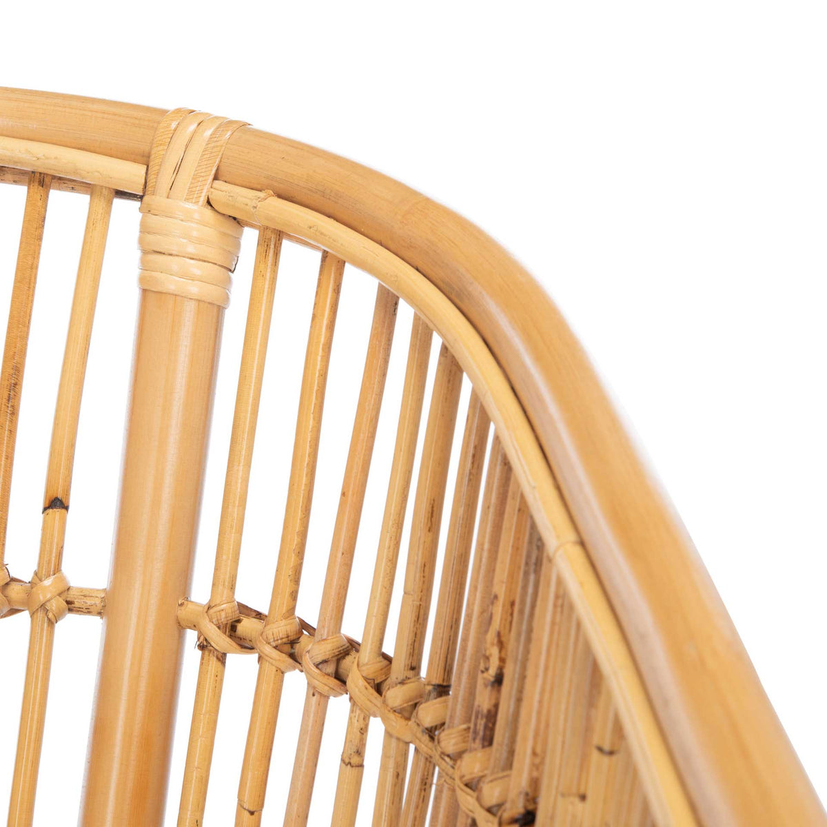 A smooth natural rattan top rail curves over slender spindles with neatly wrapped joints.