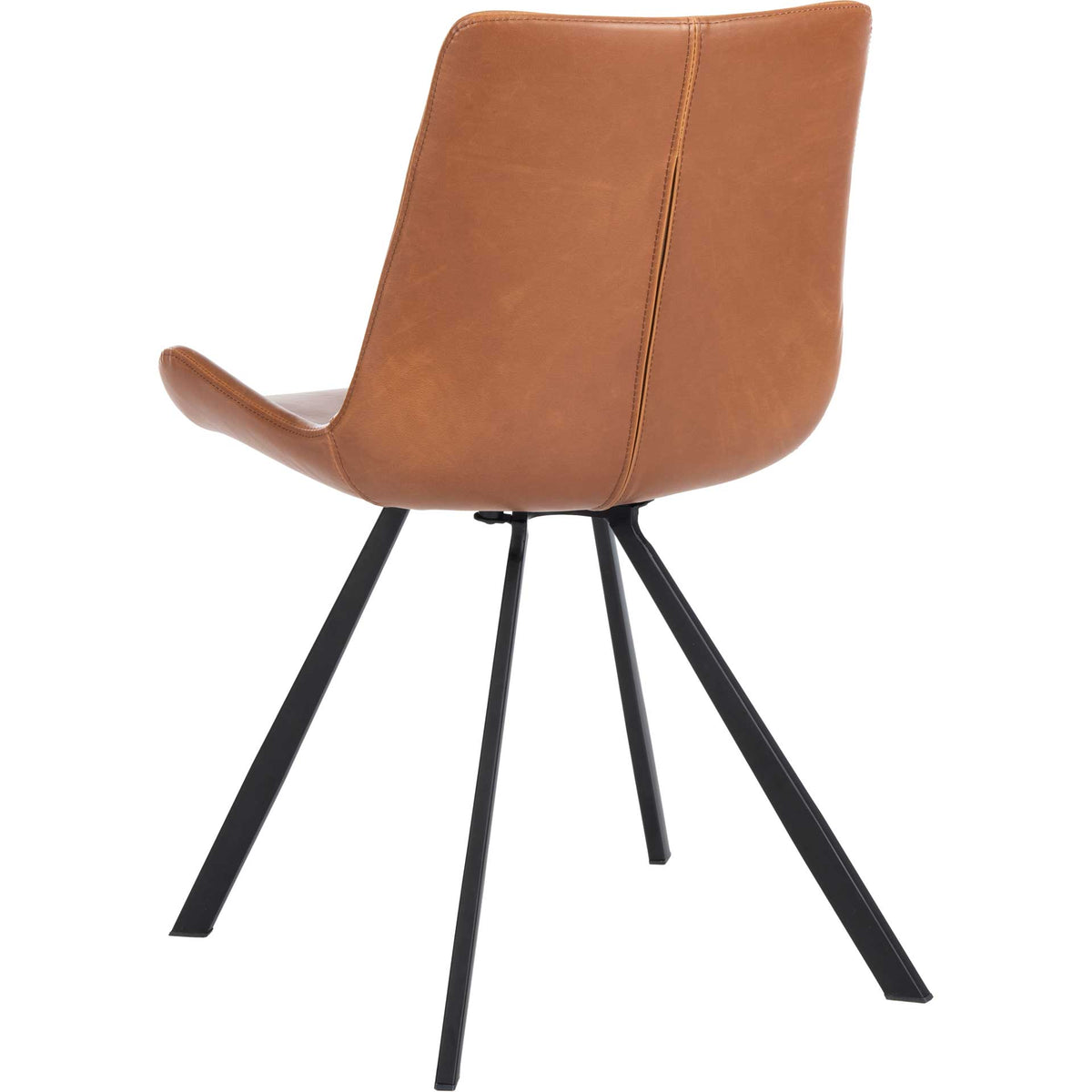 Cognac upholstery wraps the rounded chair back, with stitched seams and slim black legs
