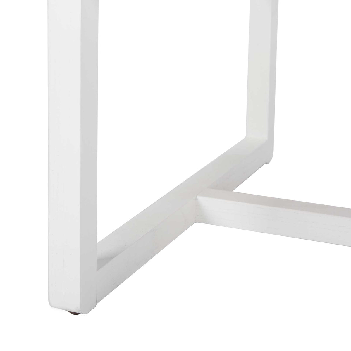 A white wood leg meets low geometric rails to create a clean, open chair base.