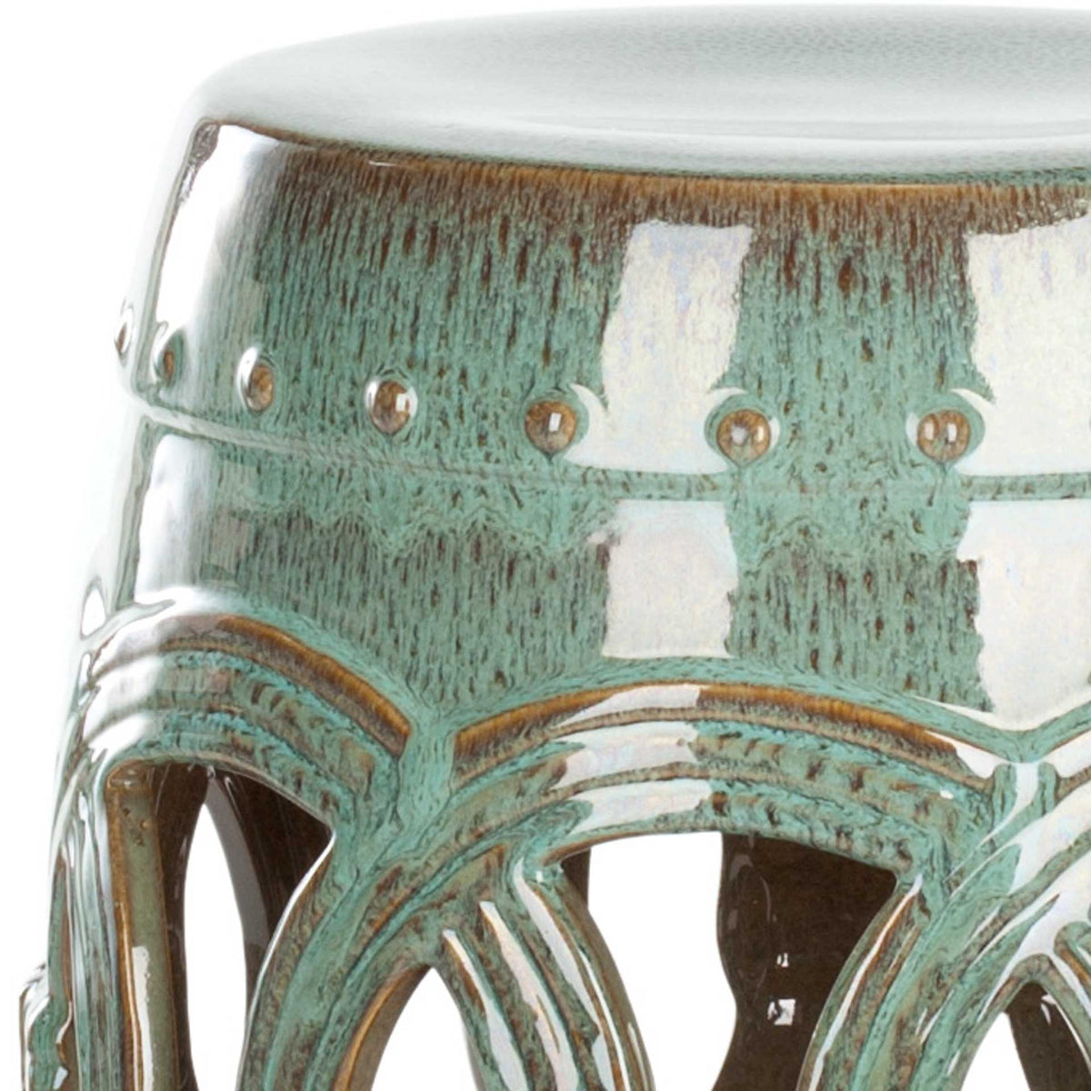Antique blue glaze, raised dot trim, and sculpted arches add texture to this ceramic stool