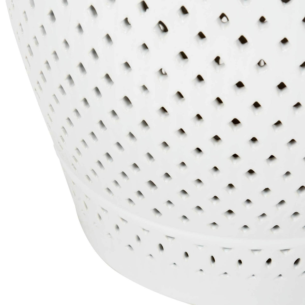 Diamond-shaped perforations wrap the curved body above a solid ceramic base