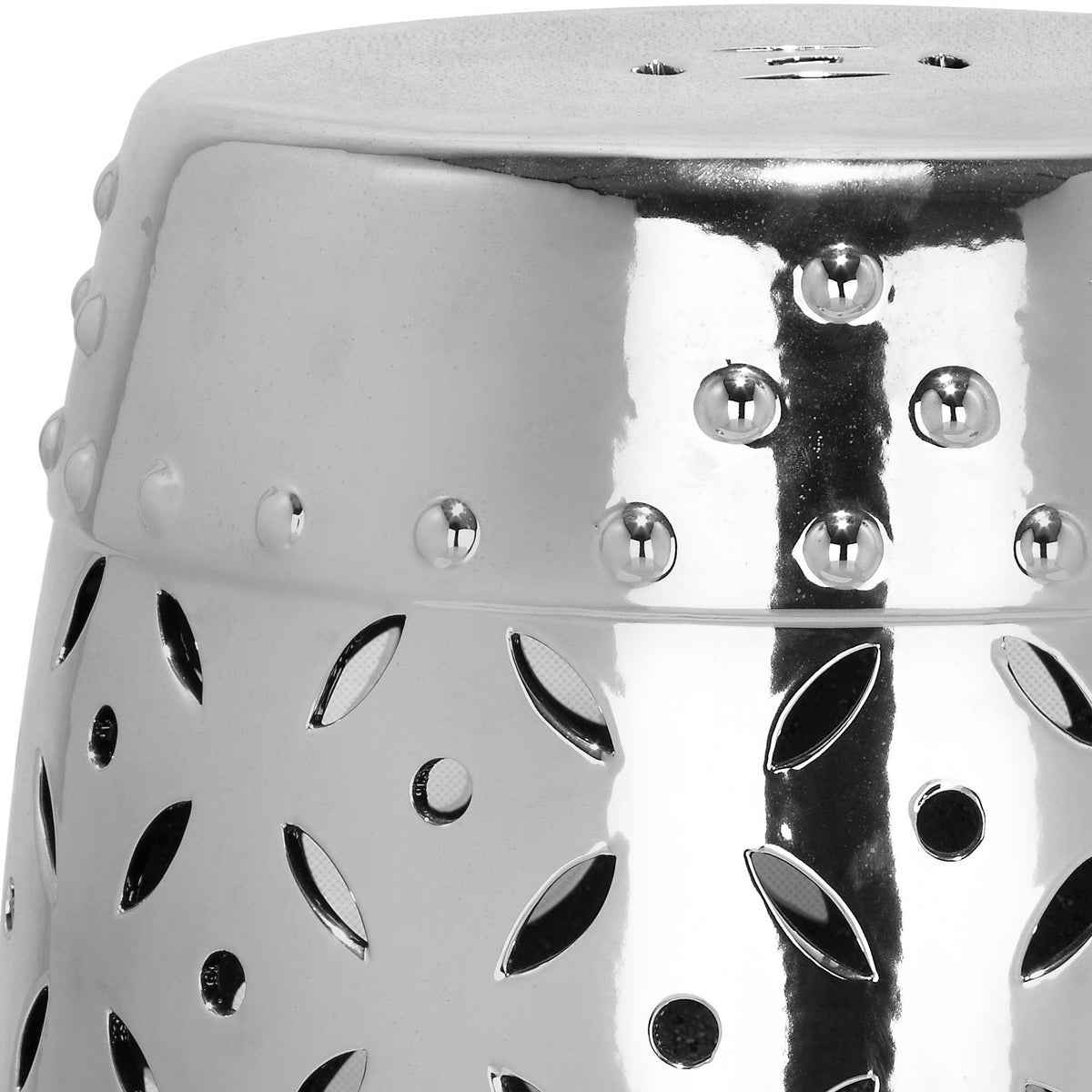 Shimmering silver glaze and raised studs frame petal-shaped cutouts