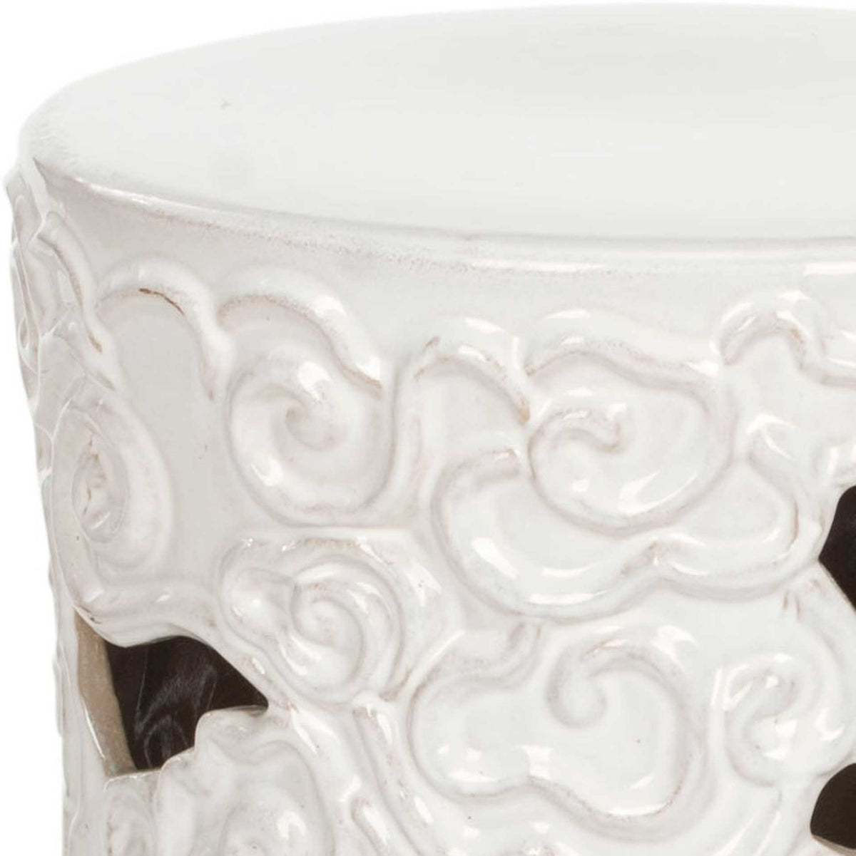 Raised white cloud scrolls and open cutouts add texture beneath the stool's smooth top