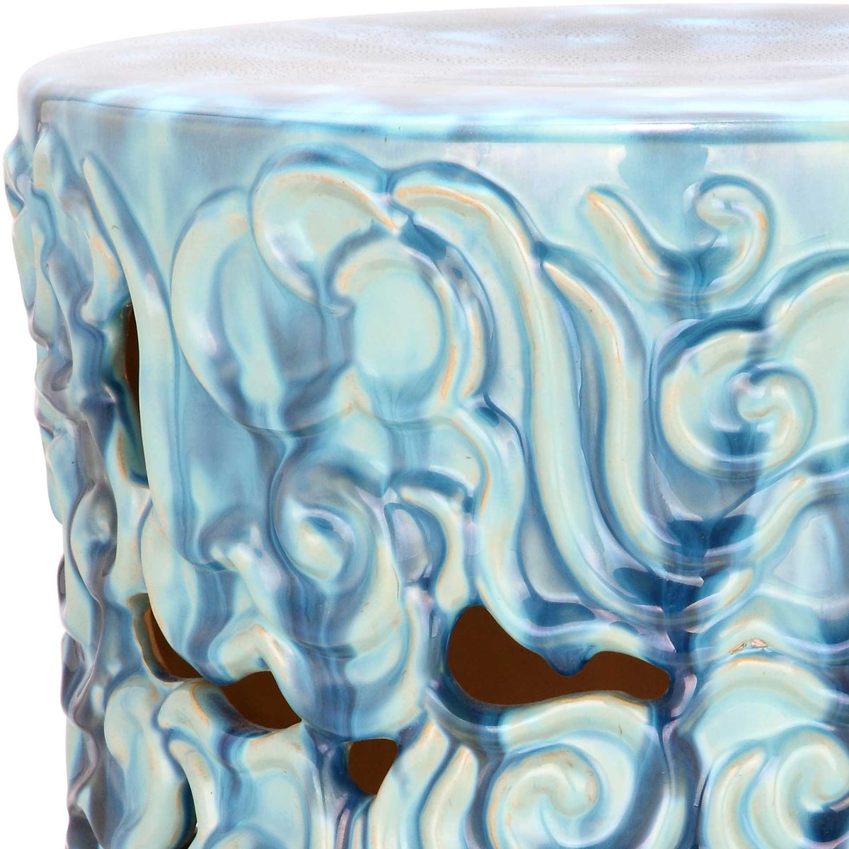 Iridescent blue glaze highlights raised cloud scrolls and cutouts beneath the ceramic rim