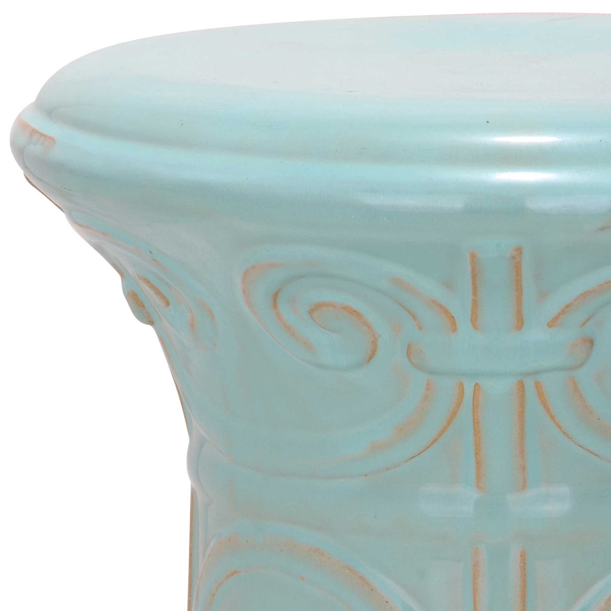 Glossy light aqua glaze and subtle tan accents trace the raised scrollwork and rounded rim
