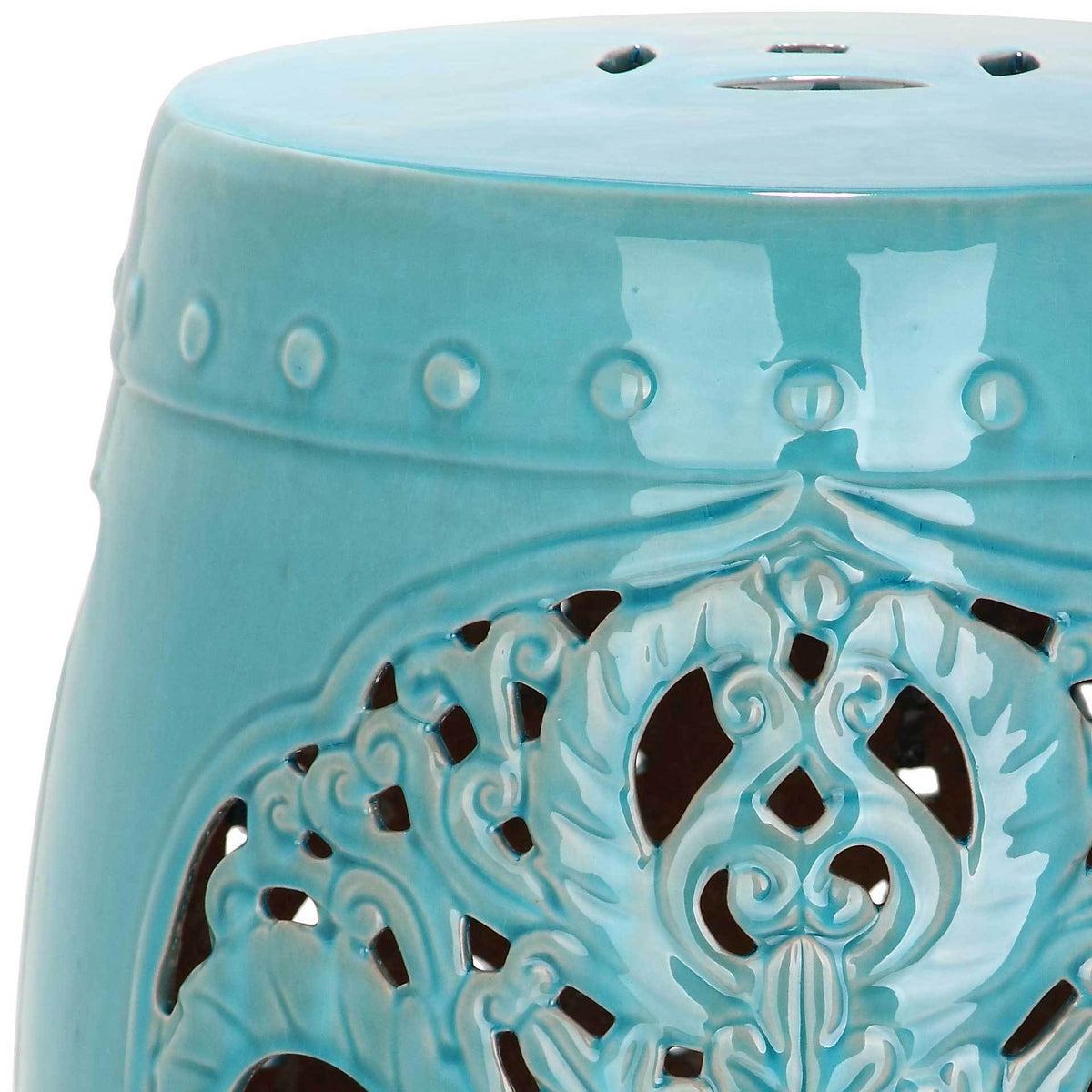 Aqua-blue glaze accentuates raised beads and delicately pierced floral scrollwork.