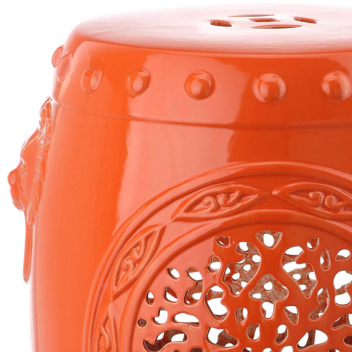 Glossy orange glaze shines across raised beading and an intricate openwork medallion