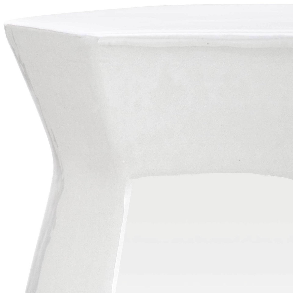 A clean white glaze defines the broad rim and softly recessed geometric facets.
