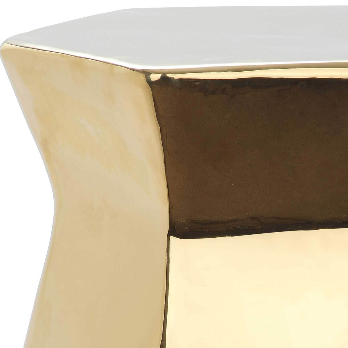 Reflective gold finish emphasizes the crisp top edge and sculptural side panels.
