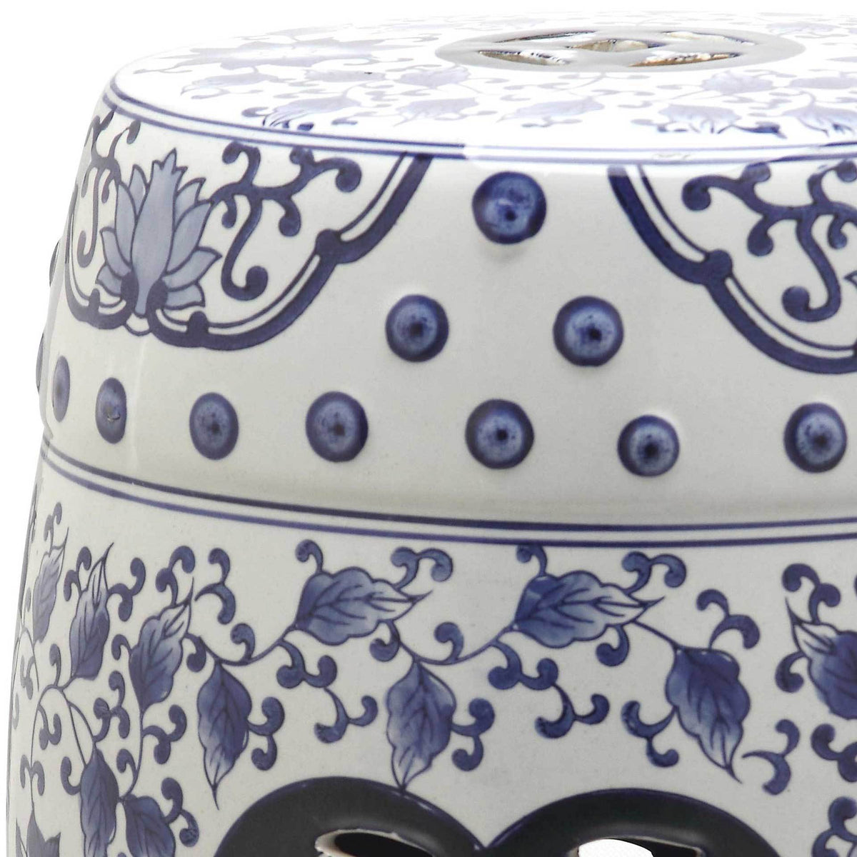 Glossy white ceramic adorned with blue floral scrollwork and dotted borders