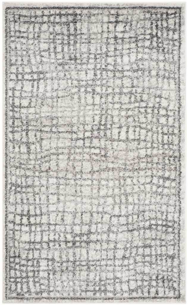 A compact 3' x 5' rug mixes softly worn silver linework with an ivory base.