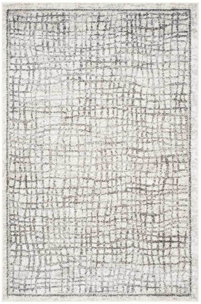 A 4' x 6' rug adds airy silver gridwork and a clean border to an ivory ground.
