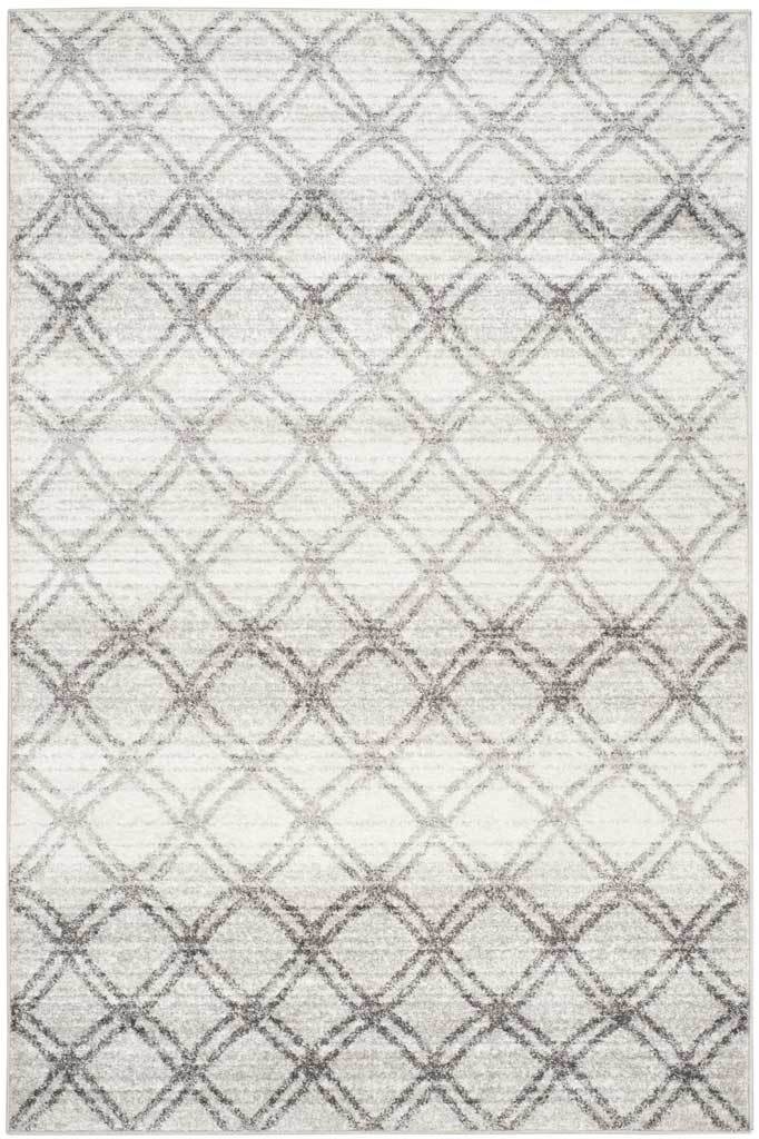 Weathered charcoal diamonds add gentle movement to a silver rectangular rug