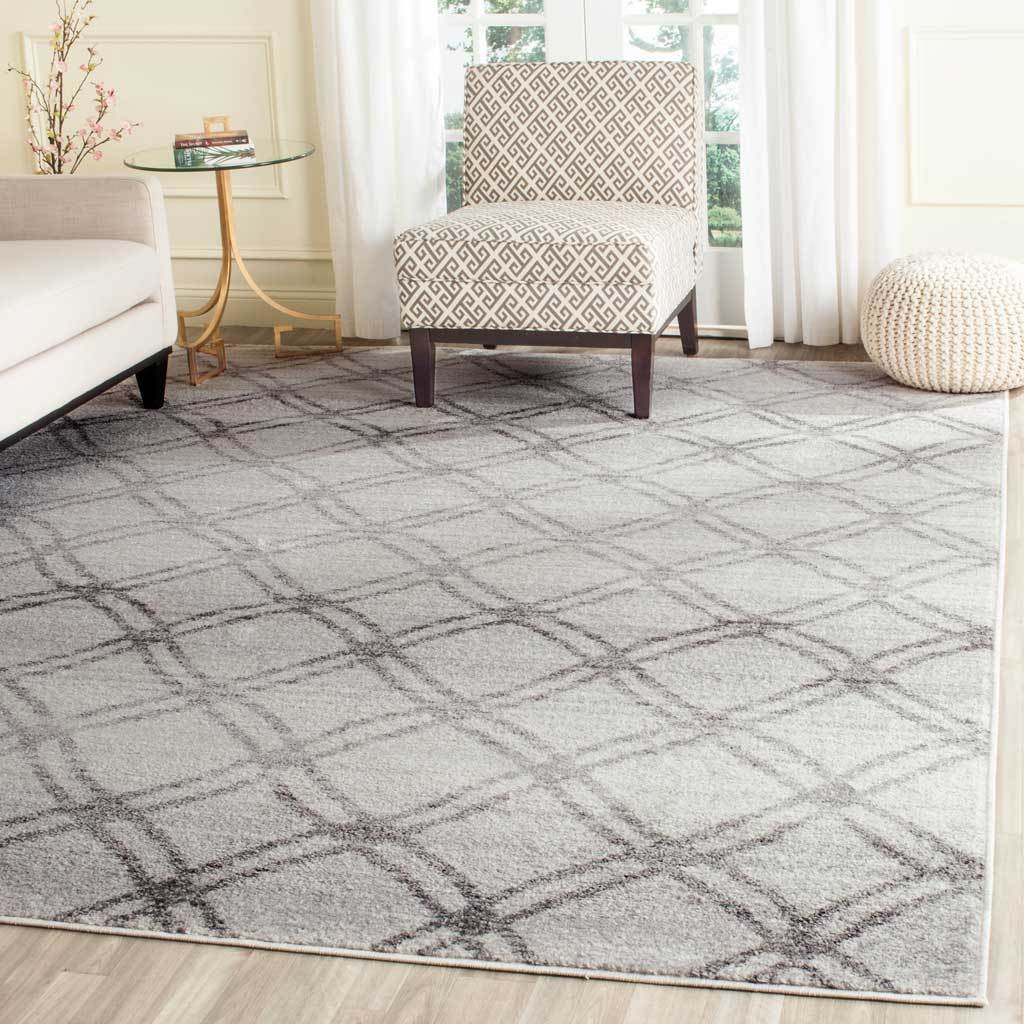 A wide silver and charcoal diamond trellis adds texture beneath a bright seating area
