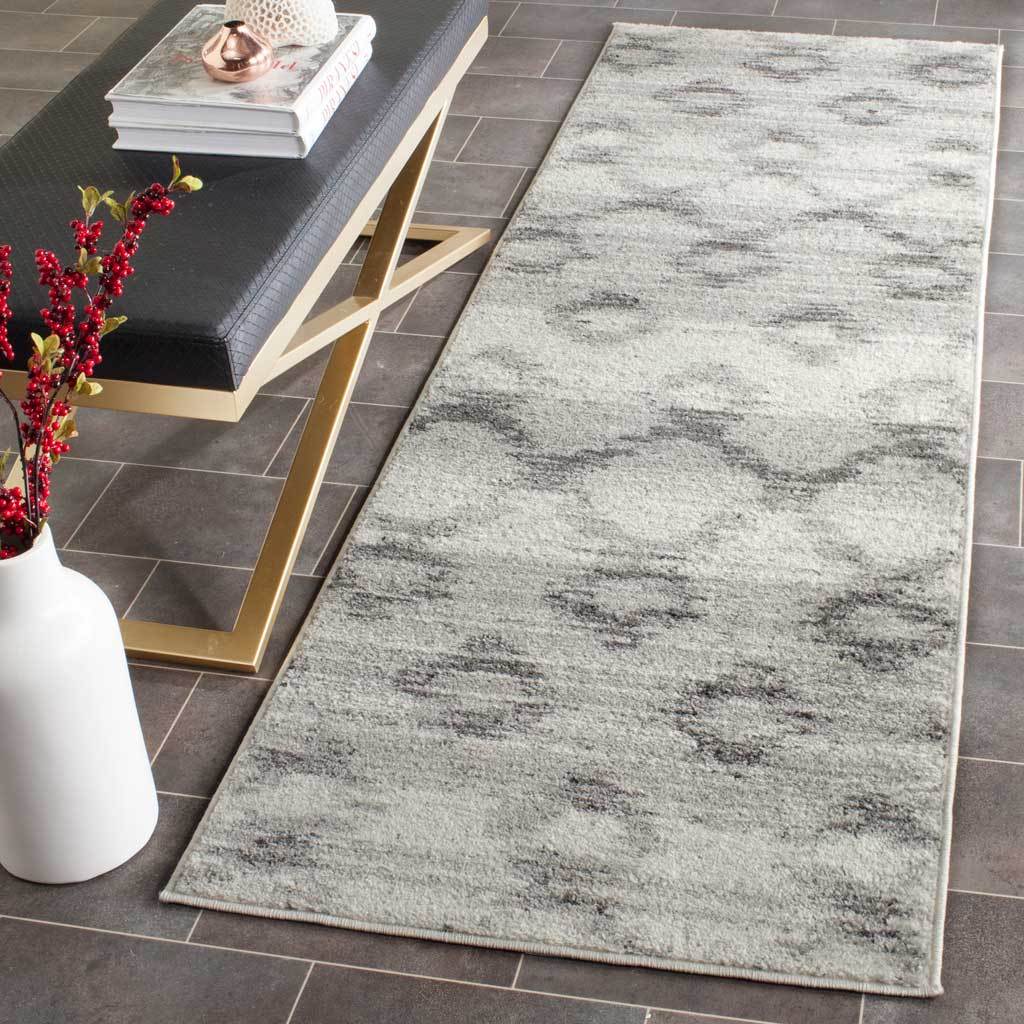 Silver and charcoal runner adds understated, distressed texture to a tiled interior