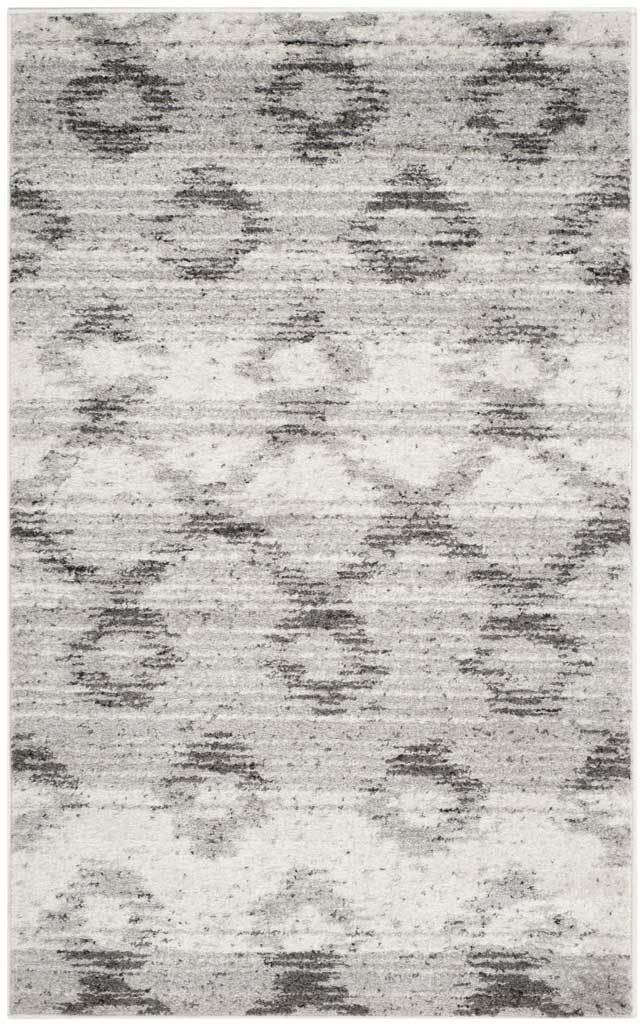 Compact silver and charcoal rug features a faded geometric pattern and textured horizontal lines