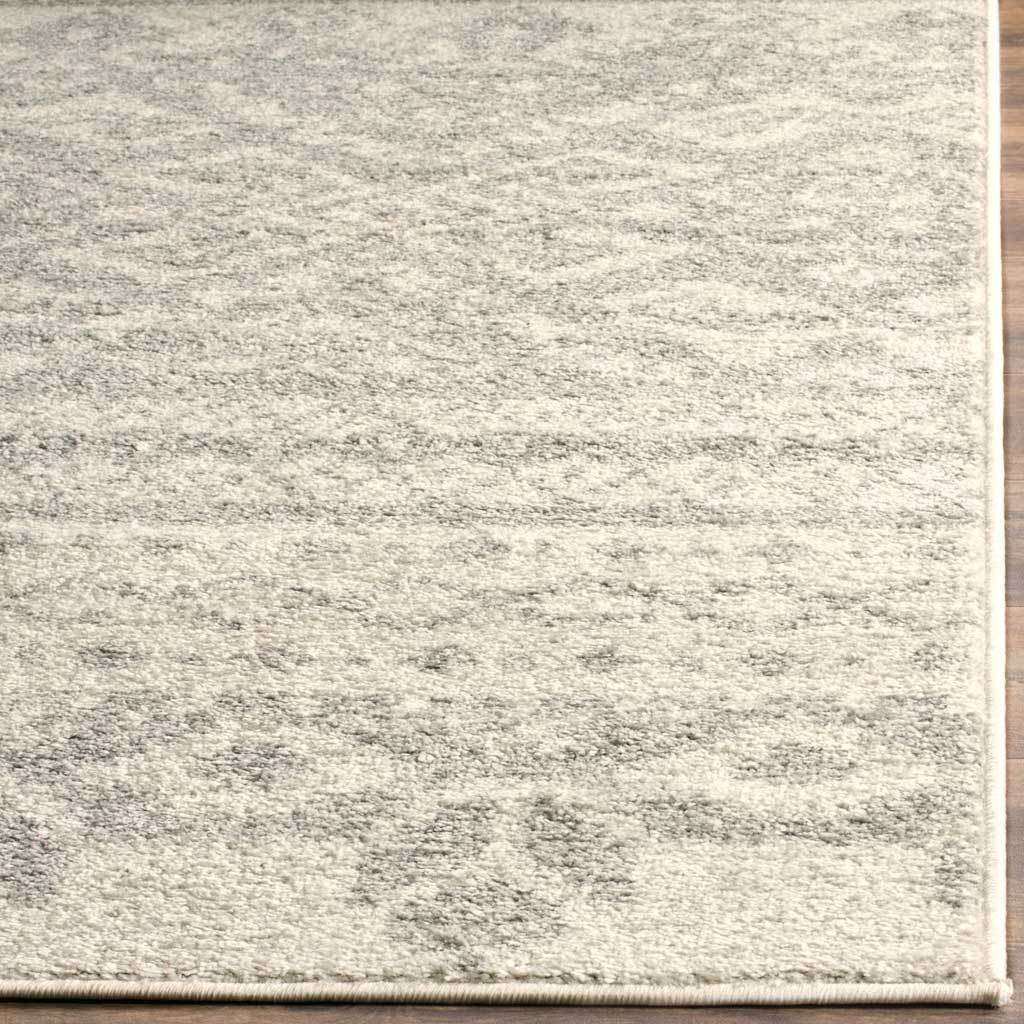Finely bound edges frame softly mottled ivory and silver fibers with inviting texture.