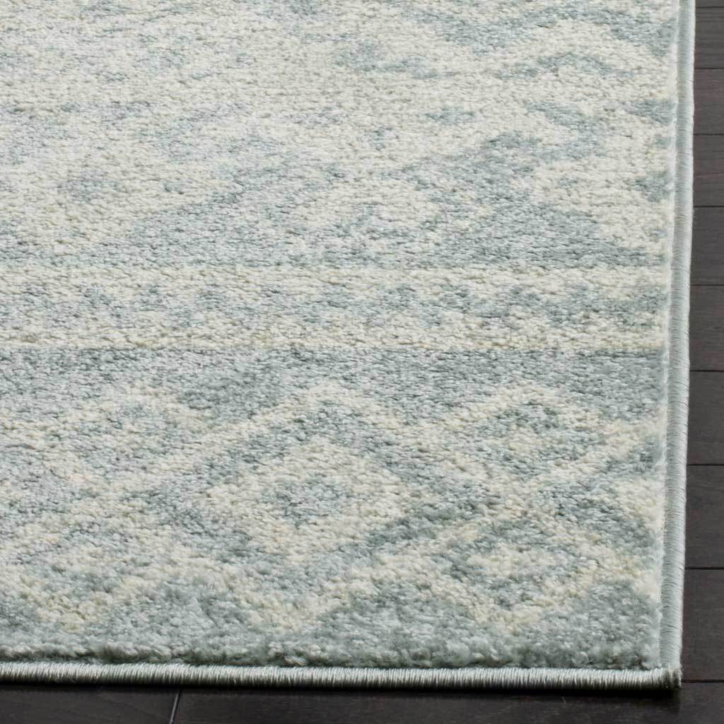 Soft slate and ivory fibers meet at neatly bound edges with a subtle, textured finish.
