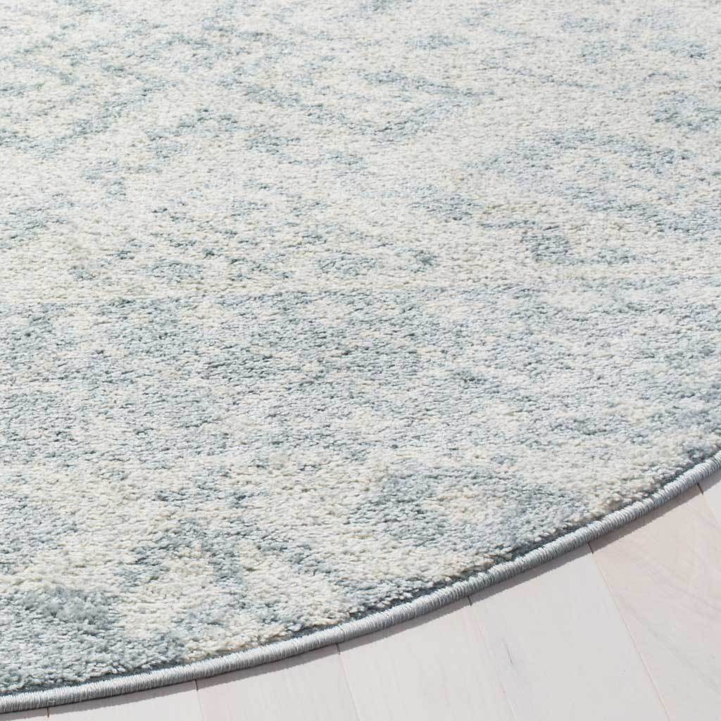 Subtle slate and ivory patterning reveals a textured pile and smoothly bound edge.