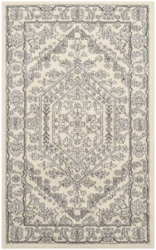 Small ivory and silver rug with vintage-inspired florals and a layered border.