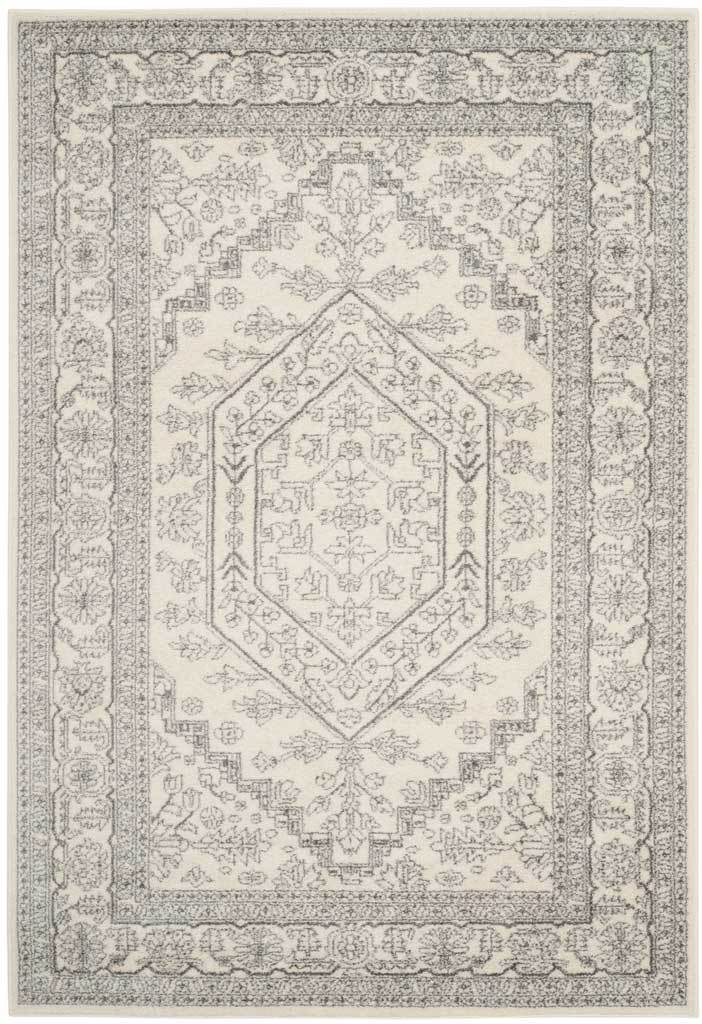 Ivory and silver rug pairs a delicate central medallion with a detailed floral border.