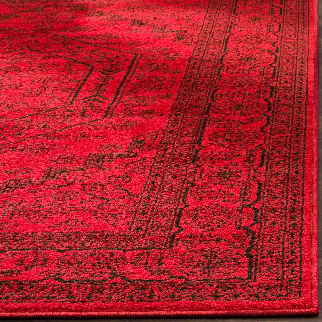 Intricate black lines texture the bright red pile around a cleanly bound corner.