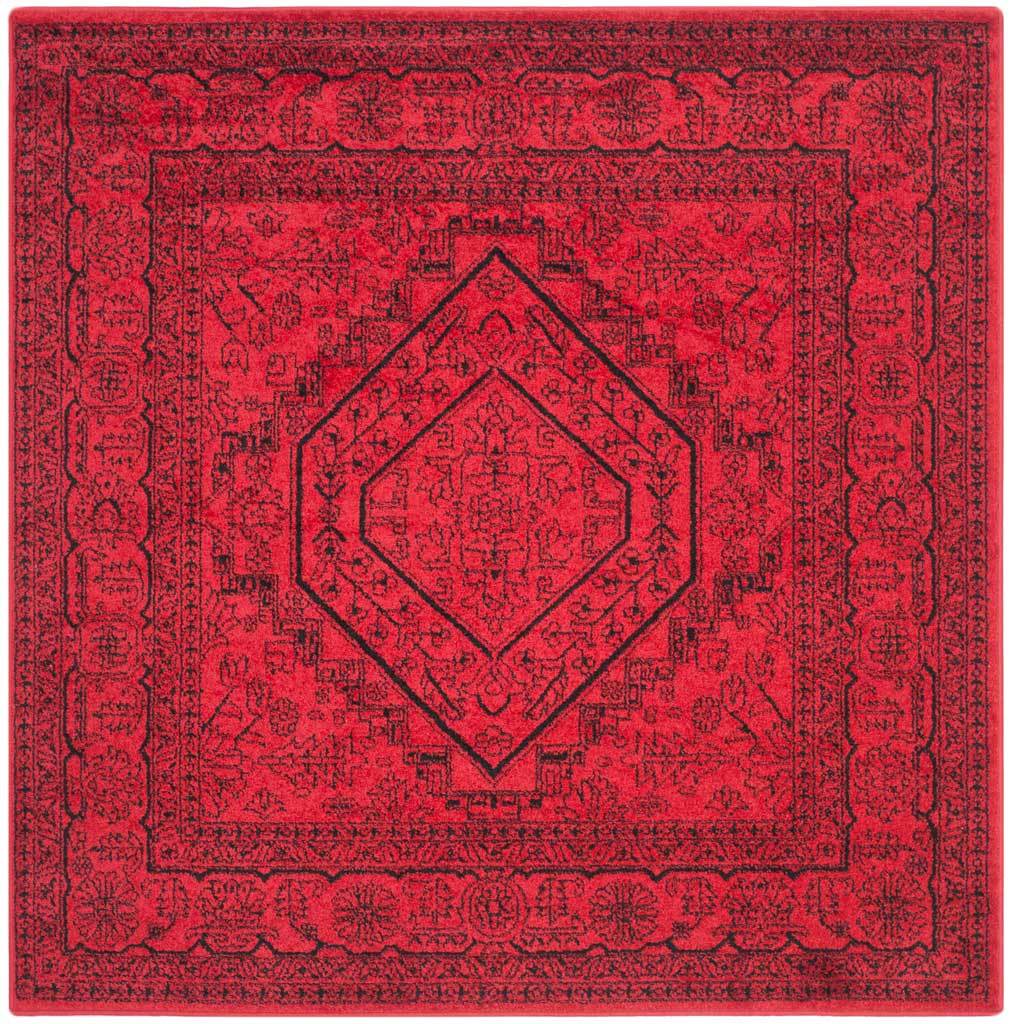 Square red and black rug features a symmetrical hexagonal medallion and floral border.