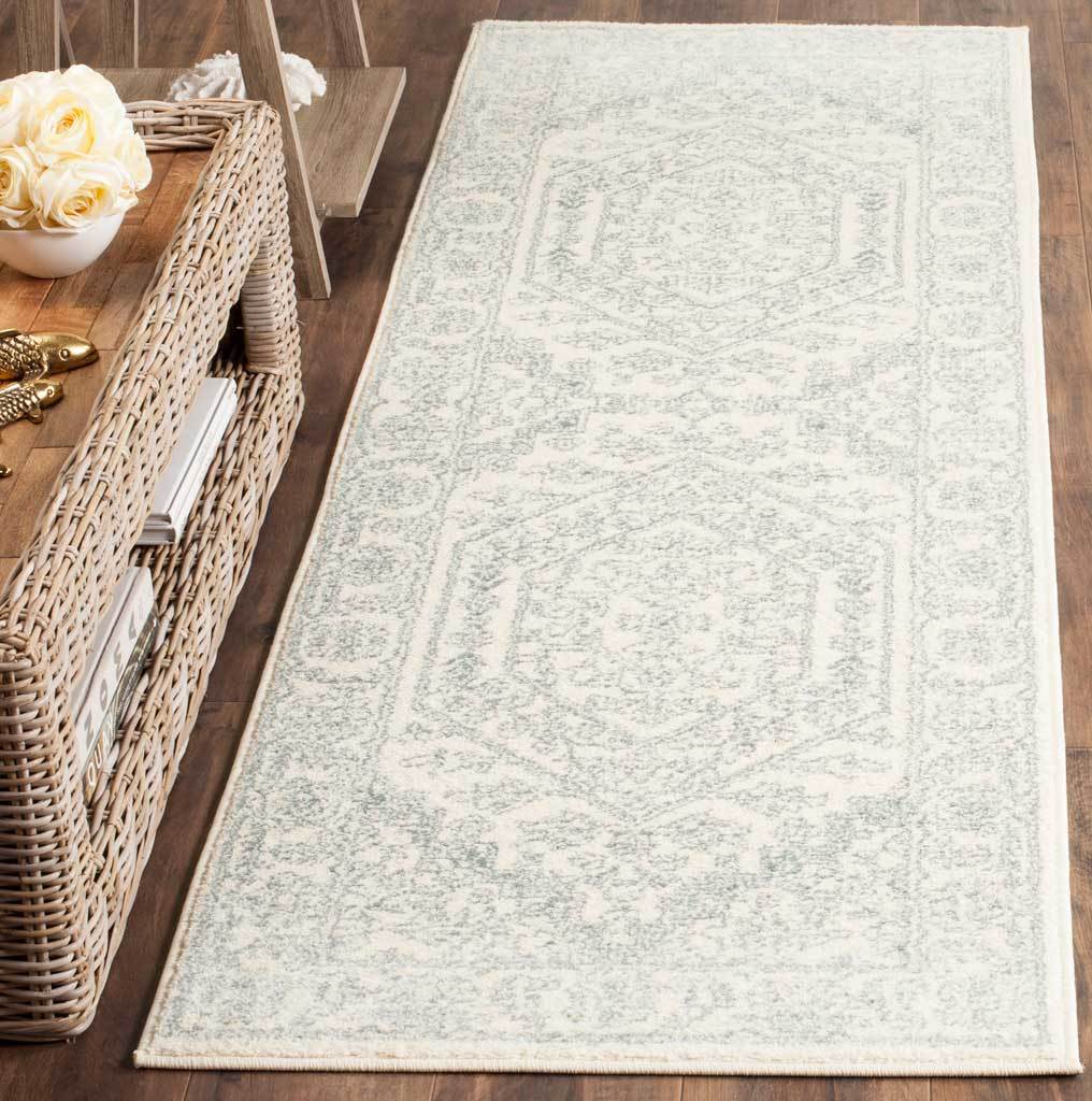 Airy ivory runner with muted slate medallions and a delicate traditional border