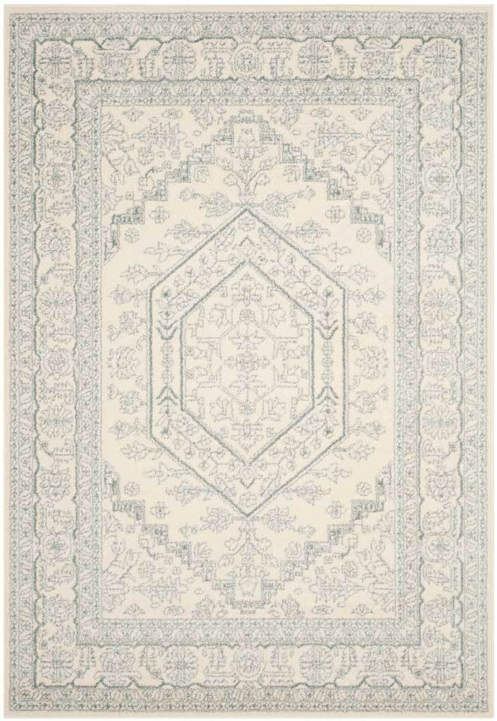 Soft ivory rug features a muted slate medallion and finely detailed floral borders.