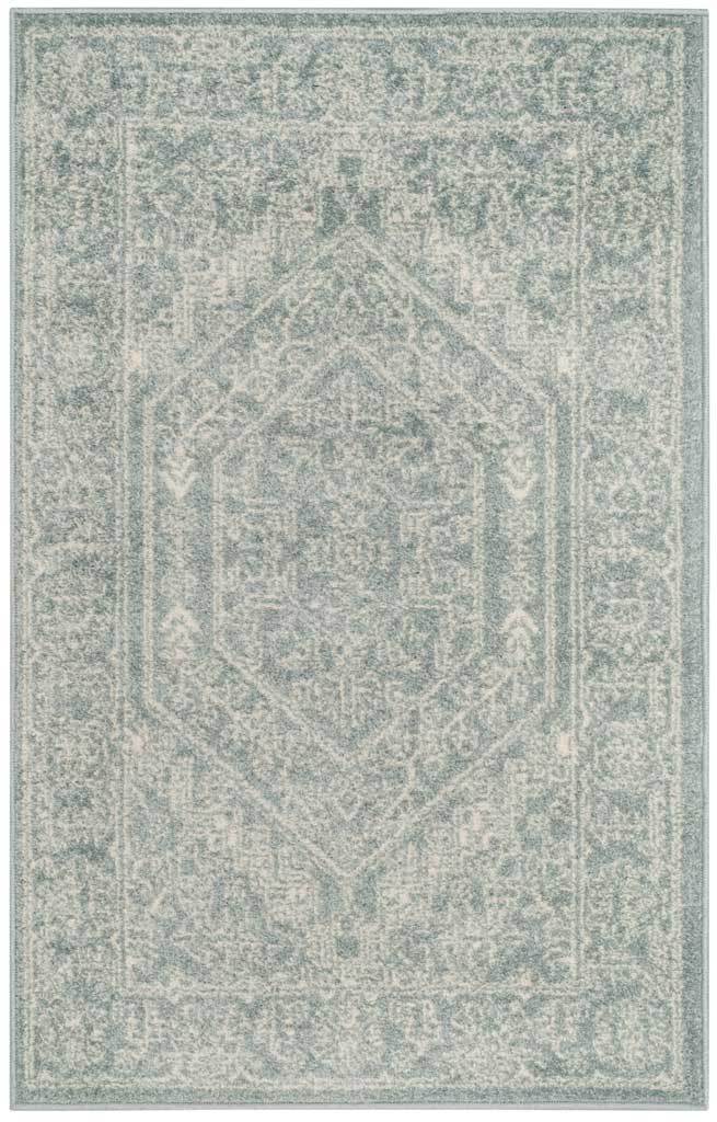 Small slate and ivory rug offers subdued floral patterning and a geometric medallion.