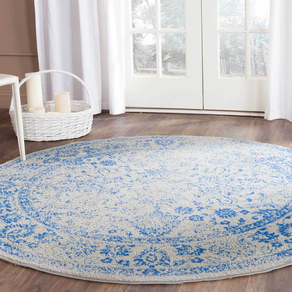 Bright blue florals bring character to this softly distressed round rug