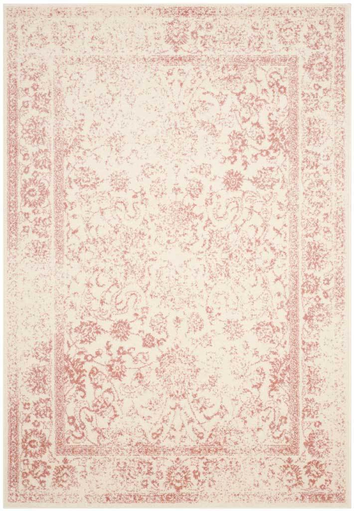 Dusty rose flourishes trail across an ivory rug with a classic framed center.