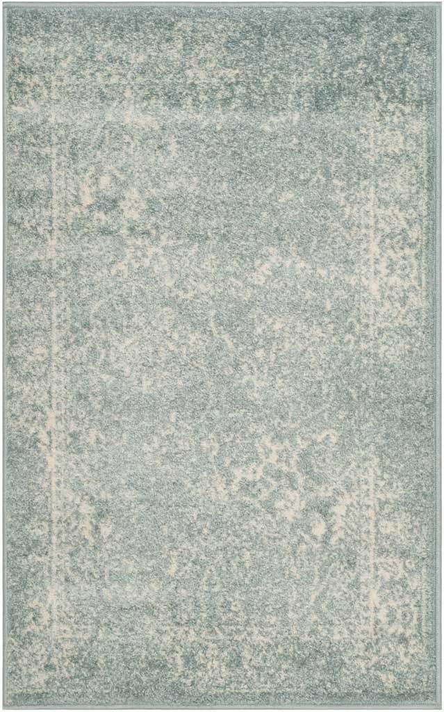 A compact slate rug has soft ivory ornamental flecks and a worn-in look.