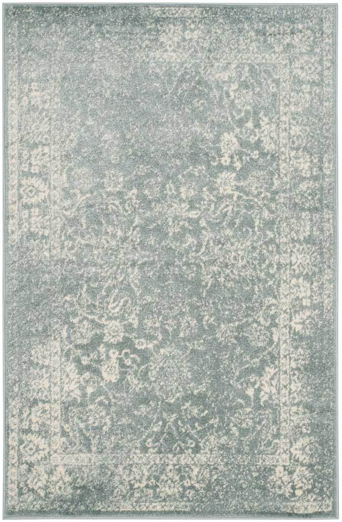 Ivory botanical motifs and a vintage-style border brighten a slate rug.