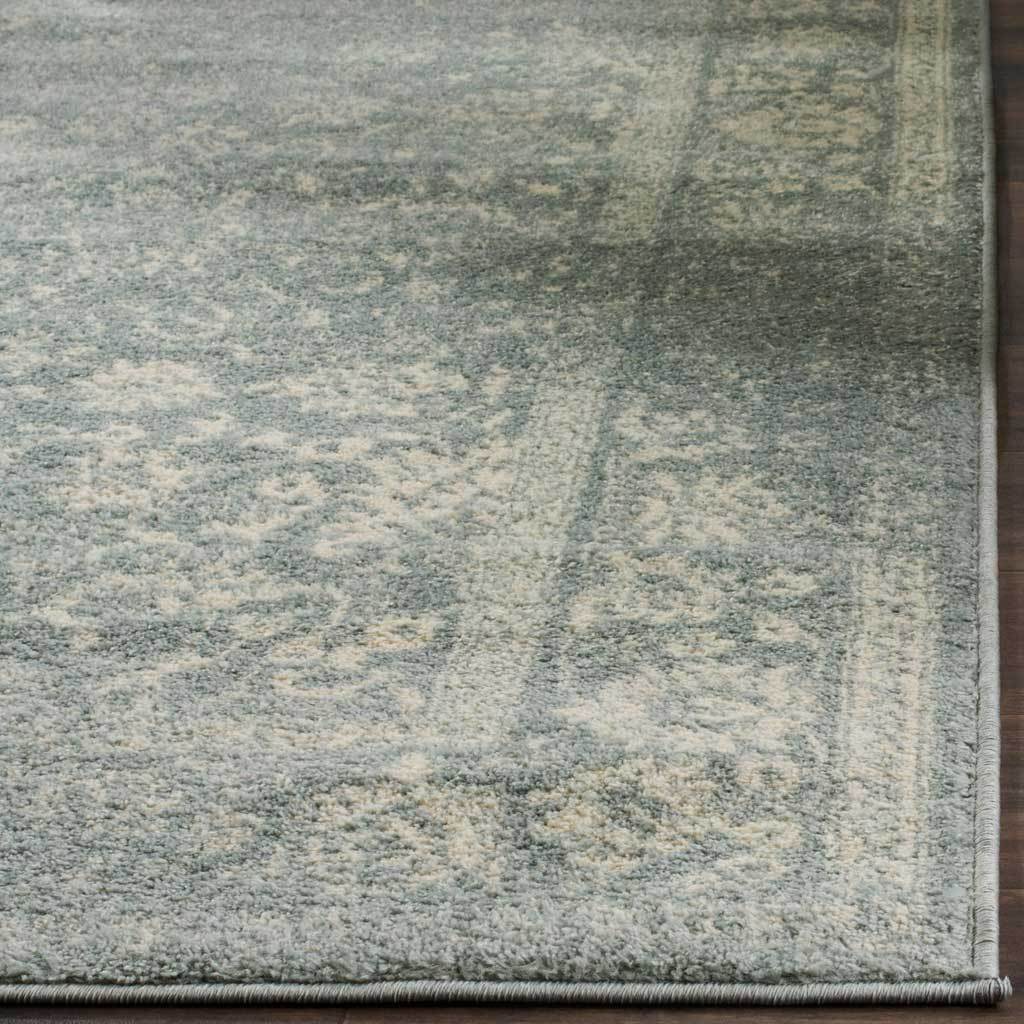 Soft slate pile carries fading ivory flourishes beside a bound edge.