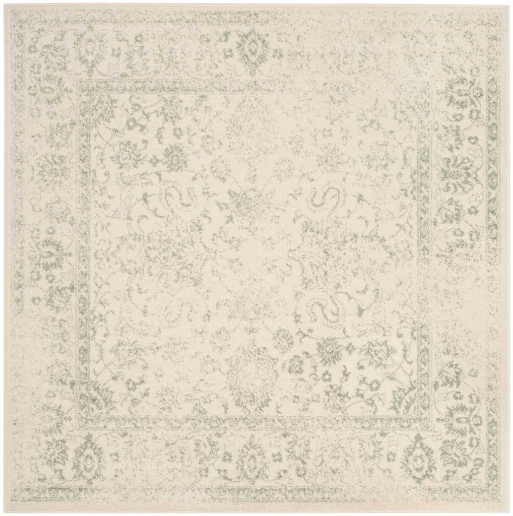 Sage floral vines and a faded border drift across an ivory rectangular rug. || ADR109V-8 || top_studio