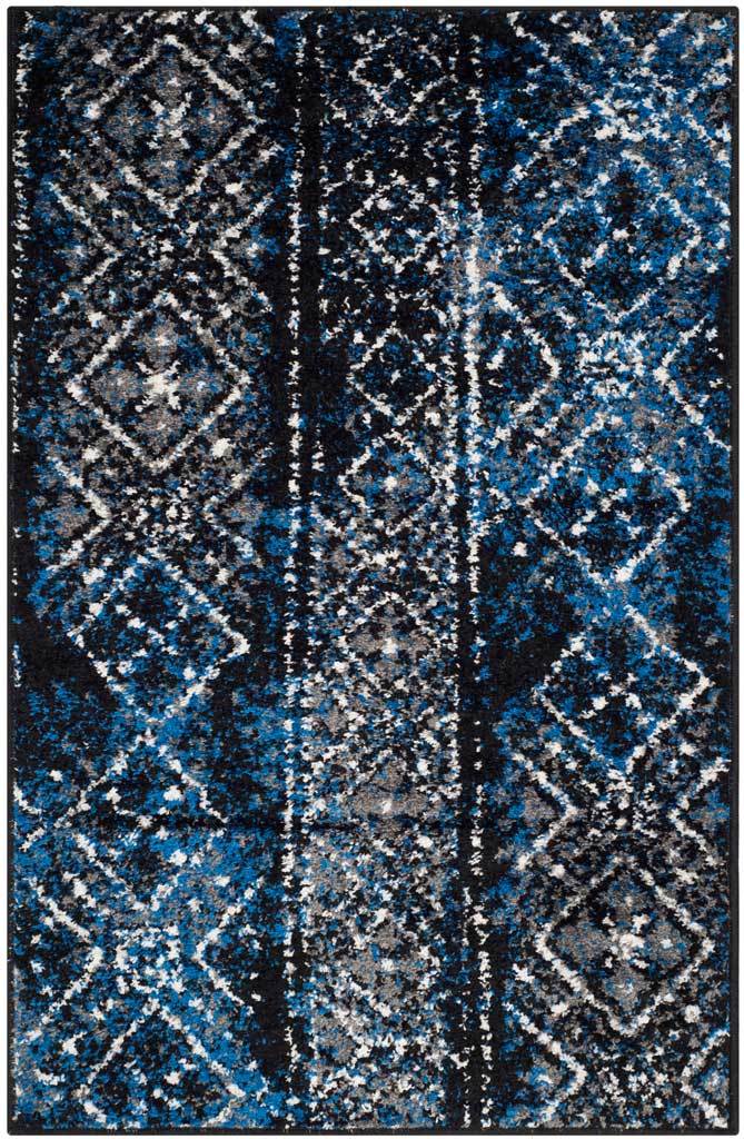 Blue and black accent rug packs intricate white motifs into vivid cobalt bands