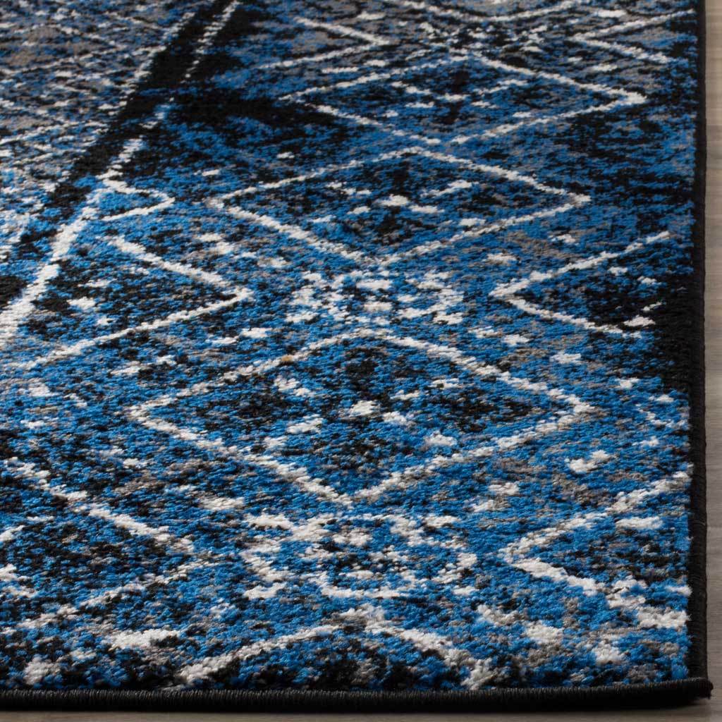Cobalt and black pile is traced with pale diamonds and finished with a dark binding