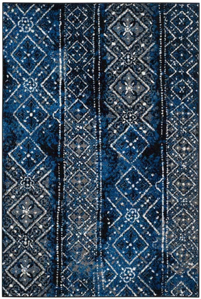 Blue and black area rug pairs vibrant cobalt tones with vintage-inspired diamonds